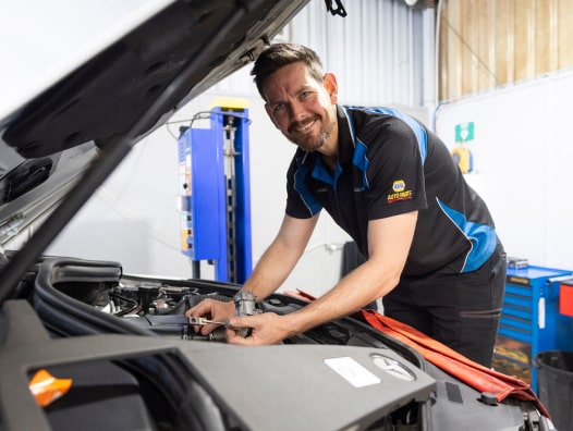 inspecting under the vehicle hood